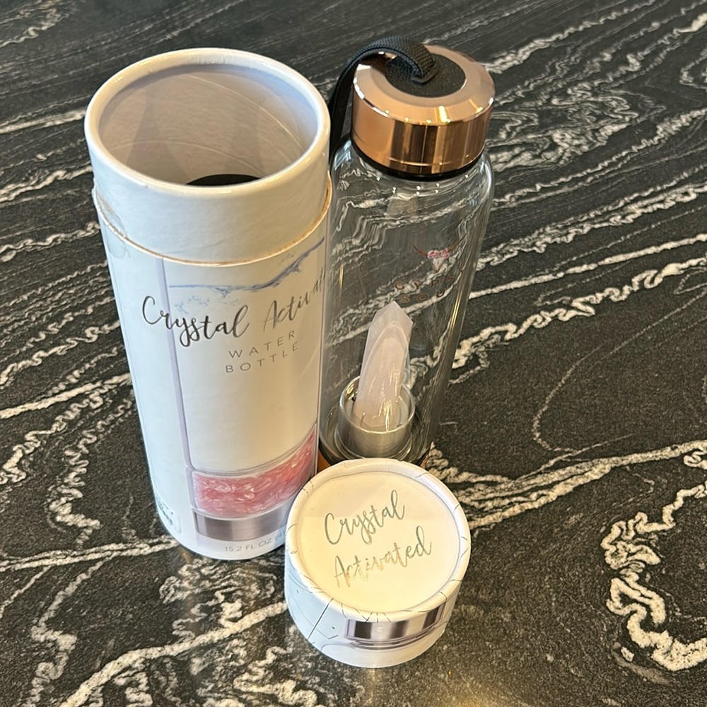 Water bottle with rose quartz crystal